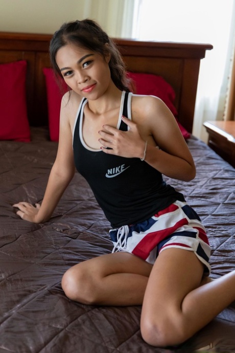 Adorable Thai babe Chutima exposes her slender figure and gets rammed on a bed