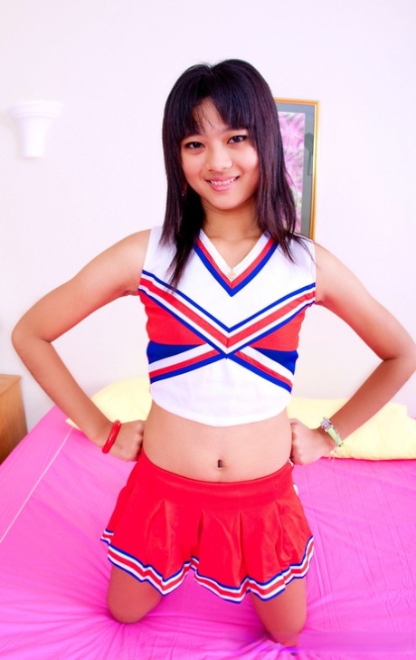 Asian schoolgirl Powder unveils her tiny tits & her tight shaved pussy