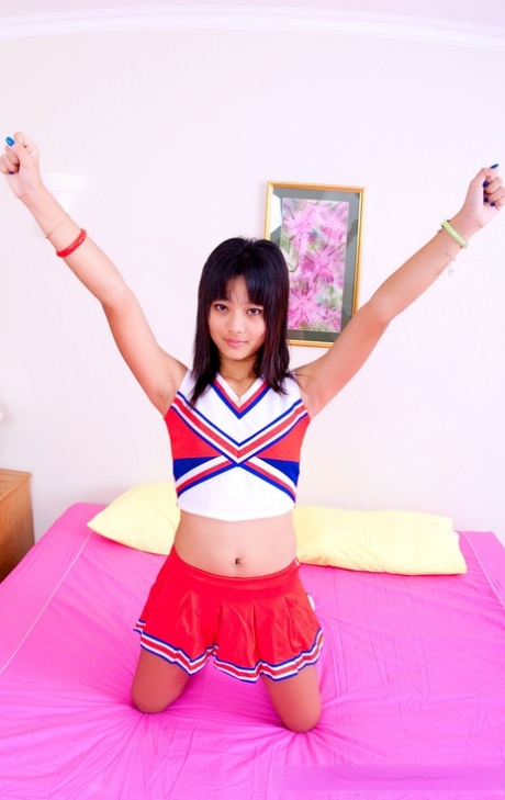 Asian schoolgirl Powder unveils her tiny tits & her tight shaved pussy