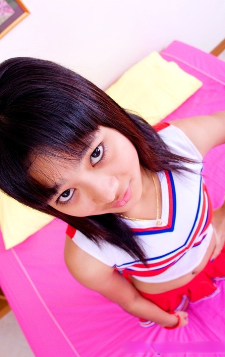 Asian schoolgirl Powder unveils her tiny tits & her tight shaved pussy