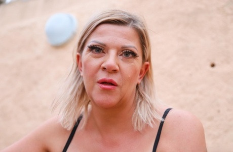 Blonde granny Ann Bazuka exposes her tits & masturbates on the steps outdoors