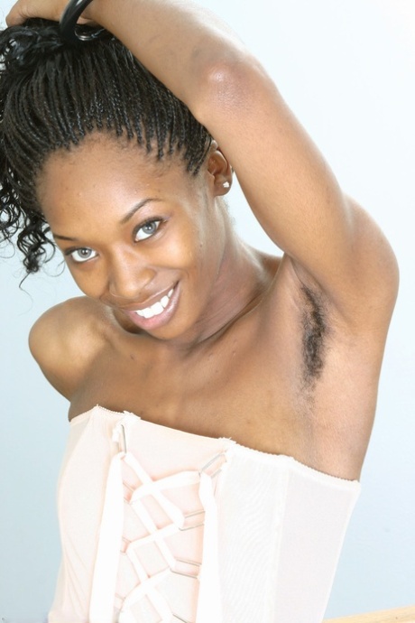 Ebony stunner Nikki strips & unveils her slender body and hairy pussy