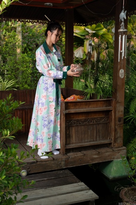 Adorable Asian teen Mayuko exposes her lovely big ass and hot pussy outdoors