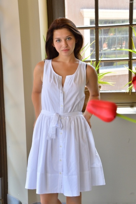 Brunette cutie Ariana rides a massive rubber dildo wearing a white dress