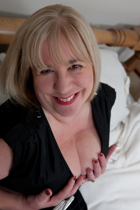 Charming fatty Auntie Trisha squeezes her big tits & toys her mature pussy