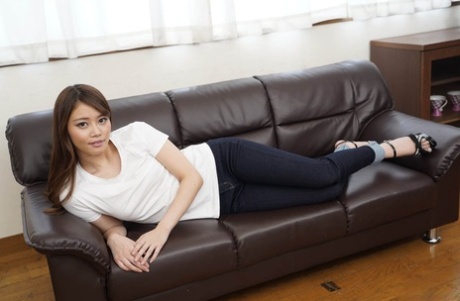 Japanese beauty Non Suzumiya gives a BJ & gets fucked through her ripped jeans