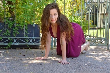 Pretty babe Avri flashes her ass and twat outdoors before fisting herself