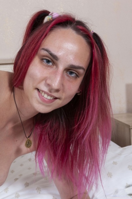 Naughty amateur Foxy Slave plays with her hairy pussy on her bed