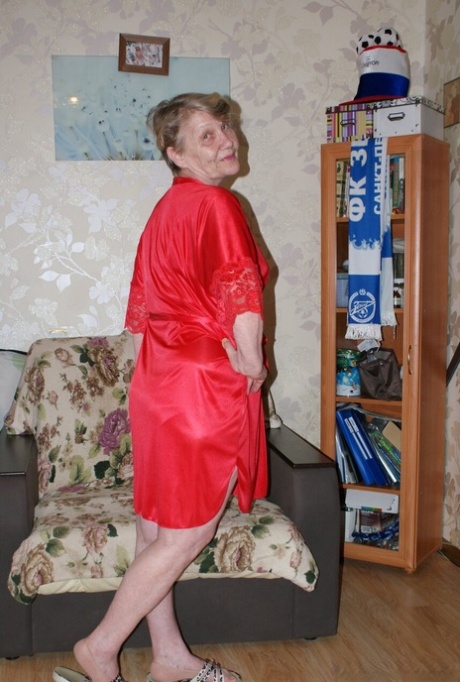 Blonde granny Belly loses her red lingerie & shows her saggy tits & hairy cunt