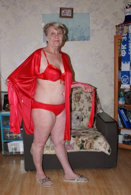 Blonde granny Belly loses her red lingerie & shows her saggy tits & hairy cunt