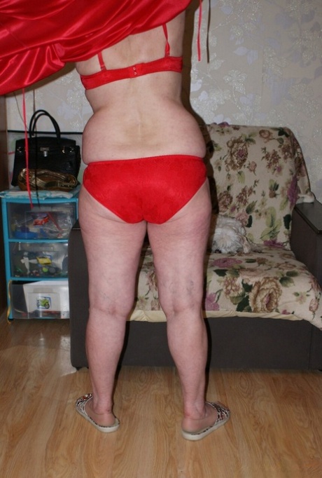 Blonde granny Belly loses her red lingerie & shows her saggy tits & hairy cunt