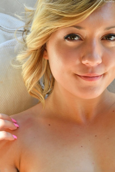 Sexy blonde babe Rachelle poses naked and rubs her tasty love holes