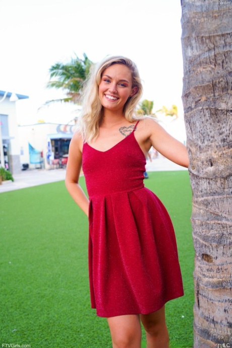 Cute blonde Winter hikes her red dress up and touches her cunt in public