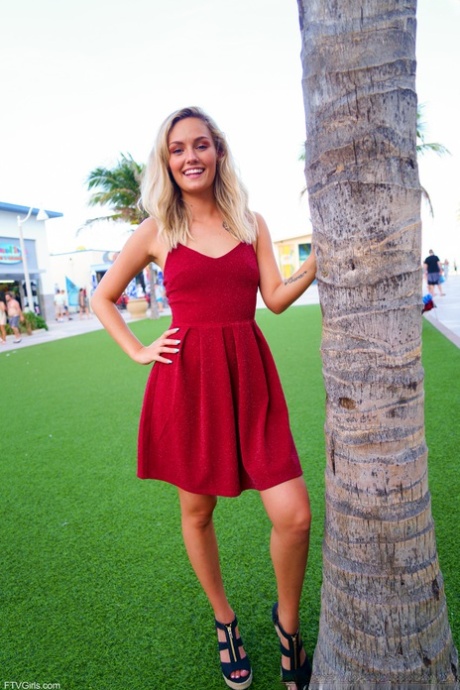 Cute blonde Winter hikes her red dress up and touches her cunt in public