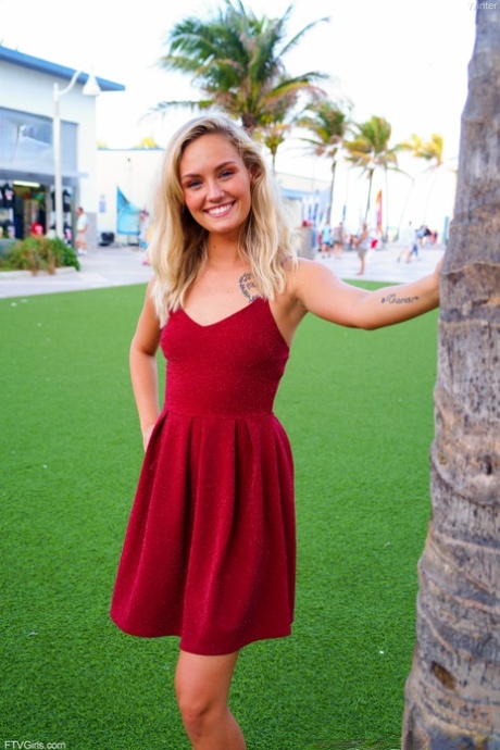 Cute blonde Winter hikes her red dress up and touches her cunt in public