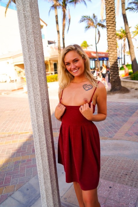 Cute blonde Winter hikes her red dress up and touches her cunt in public