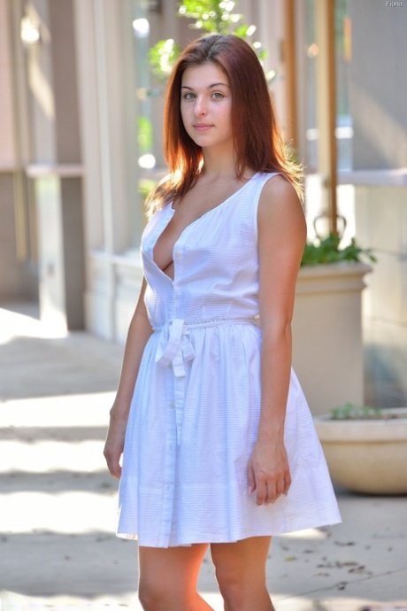 Gorgeous brunette teen Fiona flashing her shaved pussy in public